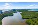 High angle landscape view of wetlands meeting a waterway, near residences and buildings at 1750 Benjamin Franklin Dr # 6B, Sarasota, FL 34236