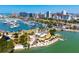 Aerial view of waterfront buildings, docks, boats, and recreational areas along the coast at 1750 Benjamin Franklin Dr # 6B, Sarasota, FL 34236