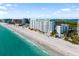 Pictureseque beachfront condos with manicured landscaping and a beautiful, sandy beach at 1750 Benjamin Franklin Dr # 6B, Sarasota, FL 34236