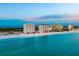 Picturesque beachfront condos with a beautiful sandy beach and bright blue skies at 1750 Benjamin Franklin Dr # 6B, Sarasota, FL 34236