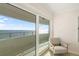 Relaxing balcony with ocean views, accessible through sliding glass doors at 1750 Benjamin Franklin Dr # 6B, Sarasota, FL 34236