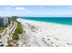 Breathtaking coastal view of turquoise ocean with soft white sand and beachfront boulevard at 1750 Benjamin Franklin Dr # 6B, Sarasota, FL 34236