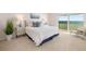 Inviting bedroom featuring ocean views, comfortable furnishings, and a serene atmosphere at 1750 Benjamin Franklin Dr # 6B, Sarasota, FL 34236