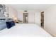 Comfortable bedroom with a view into an ensuite bath at 1750 Benjamin Franklin Dr # 6B, Sarasota, FL 34236