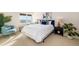 Bright bedroom featuring waterfront views, light carpet, and tasteful coastal-themed decor at 1750 Benjamin Franklin Dr # 6B, Sarasota, FL 34236