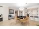 Elegant dining room with an open layout concept to the kitchen with bar seating at 1750 Benjamin Franklin Dr # 6B, Sarasota, FL 34236