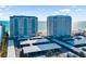 Exterior shot of high-rise beachfront condo buildings near a parking area at 1750 Benjamin Franklin Dr # 6B, Sarasota, FL 34236