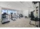 Well-equipped gym featuring a variety of exercise machines and natural light at 1750 Benjamin Franklin Dr # 6B, Sarasota, FL 34236