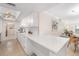 Modern kitchen featuring white cabinetry, quartz countertops, and stainless steel appliances at 1750 Benjamin Franklin Dr # 6B, Sarasota, FL 34236