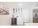 Modern kitchen area with a wine cooler, stainless steel appliances, and ample storage space at 1750 Benjamin Franklin Dr # 6B, Sarasota, FL 34236