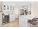 Well-equipped kitchen featuring a wine cooler, breakfast bar, and stainless steel appliances at 1750 Benjamin Franklin Dr # 6B, Sarasota, FL 34236