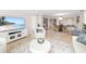 Inviting living space with an open concept to the dining area and kitchen with beach views at 1750 Benjamin Franklin Dr # 6B, Sarasota, FL 34236
