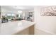 Stylish living area with coastal views, open floor plan, and elegant decor at 1750 Benjamin Franklin Dr # 6B, Sarasota, FL 34236