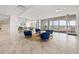 Bright lobby with comfortable blue seating, marble floors, and beach access at 1750 Benjamin Franklin Dr # 6B, Sarasota, FL 34236