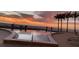 A beautiful pool on the beach at sunset at 1750 Benjamin Franklin Dr # 6B, Sarasota, FL 34236