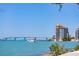 Scenic waterfront view featuring a building with a gold dome, a bridge, and boats on the water at 1750 Benjamin Franklin Dr # 6B, Sarasota, FL 34236