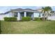 Large backyard with grass, fence, and palm tree at 17549 Timberline Pkwy, Punta Gorda, FL 33982