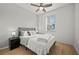 Cozy bedroom featuring a bed, stylish lamps, and a ceiling fan at 17549 Timberline Pkwy, Punta Gorda, FL 33982