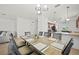 Open-concept dining area showcasing a large table and chairs, flowing seamlessly into the living space at 17549 Timberline Pkwy, Punta Gorda, FL 33982