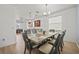A spacious dining room boasting a large table and chairs adjacent to the kitchen area at 17549 Timberline Pkwy, Punta Gorda, FL 33982