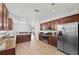Well-appointed kitchen with granite countertops, stainless steel appliances, and plenty of cabinet space for storage at 17549 Timberline Pkwy, Punta Gorda, FL 33982