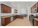 Spacious kitchen featuring stainless steel appliances, granite countertops, and ample cabinet space at 17549 Timberline Pkwy, Punta Gorda, FL 33982