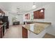 Modern kitchen with granite countertops, stainless steel appliances, and a breakfast nook with natural light at 17549 Timberline Pkwy, Punta Gorda, FL 33982
