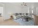 Bright living room with a comfortable sectional sofa, stylish round coffee table, and contemporary decor at 17549 Timberline Pkwy, Punta Gorda, FL 33982