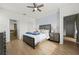 Charming main bedroom featuring wood-look floors, ensuite bath and neutral decor at 17549 Timberline Pkwy, Punta Gorda, FL 33982