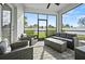 Enclosed patio featuring wicker furniture and a view of the fenced yard at 17549 Timberline Pkwy, Punta Gorda, FL 33982