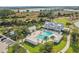 Community clubhouse and pool featuring a resort-style atmosphere, lounge chairs, and shade structures at 17549 Timberline Pkwy, Punta Gorda, FL 33982