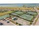 Aerial view of tennis courts, basketball court, beach volleyball, and other community recreational facilities at 17549 Timberline Pkwy, Punta Gorda, FL 33982