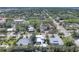 An aerial street view showcasing a neighborhood with mature trees and various architectural home styles at 1815 Grove St, Sarasota, FL 34239