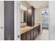 Bathroom features double vanity with marble countertop and dark wood cabinets at 1815 Grove St, Sarasota, FL 34239