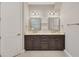 Bathroom features a double vanity with marble countertop and dark wood cabinets at 1815 Grove St, Sarasota, FL 34239