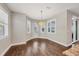 Dining area features wood floors, white trim, a modern chandelier and plantation shutters at 1815 Grove St, Sarasota, FL 34239