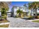 Charming two-story home with paved driveway and tropical landscaping at 1815 Grove St, Sarasota, FL 34239