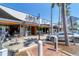 Exterior shot of Libby's Neighborhood Brasserie showcasing its facade, outdoor seating, and surrounding street view at 1815 Grove St, Sarasota, FL 34239