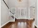 Welcoming foyer with high ceilings, hardwood floors and elegant staircase at 1815 Grove St, Sarasota, FL 34239