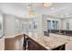 Bright kitchen and dining area features an island with bar stool seating, stainless steel appliances at 1815 Grove St, Sarasota, FL 34239