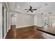Spacious living room with wood floors, trey ceiling, fan and sliding glass door at 1815 Grove St, Sarasota, FL 34239