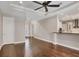 Living room overlooking the kitchen features hardwood floors and ample lighting at 1815 Grove St, Sarasota, FL 34239