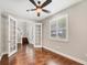 Office area features hardwood floors, neutral walls, and bright windows at 1815 Grove St, Sarasota, FL 34239