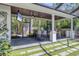 An outdoor kitchen with a large built-in grill, counter space, and ample room for dining and entertaining at 1815 Grove St, Sarasota, FL 34239