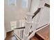 A view from the top of the staircase shows hardwood floors and white banisters at 1815 Grove St, Sarasota, FL 34239