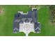 Overhead view showing the modern-style home's architectural design and surrounding landscaping at 20307 74Th E Ave, Bradenton, FL 34202