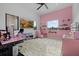 Pink bedroom with large windows, plush carpeting, and whimsical decor at 20307 74Th E Ave, Bradenton, FL 34202