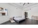 Airy bedroom featuring dark wood floors and a minimal modern aesthetic at 20307 74Th E Ave, Bradenton, FL 34202