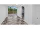 Bedroom with sliding glass doors leading to a deck and modern bathroom at 20307 74Th E Ave, Bradenton, FL 34202