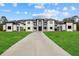 Modern home with a long driveway and a well-maintained lawn at 20307 74Th E Ave, Bradenton, FL 34202